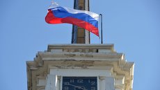Часы на башне. Архивное фото Часы на башне. Архивное фото