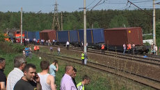 Кадры с места столкновения грузового и пассажирского поездов в Подмосковье Кадры с места столкновения грузового и пассажирского поездов в Подмосковье