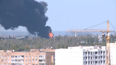 Столб густого темного дыма поднимался над аэропортом Донецка Столб густого темного дыма поднимался над аэропортом Донецка