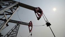 Добыча нефти в городах Ханты-Мансийского автономного округа. Архивное фото Добыча нефти в городах Ханты-Мансийского автономного округа. Архивное фото