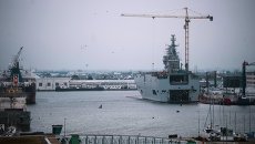 Десантный вертолетоносный корабль-док Севастополь типа Мистраль на судостроительном заводе фирмы STX Europe в городе Сен-Назер. Архивное фото Десантный вертолетоносный корабль-док Севастополь типа Мистраль на судостроительном заводе фирмы STX Europe в городе Сен-Назер. Архивное фото