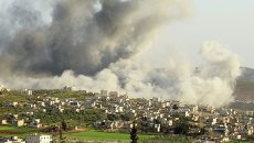 Дым от авиаудара международной коалиции по боевикам ИГ в Сирии Дым от авиаудара международной коалиции по боевикам ИГ в Сирии