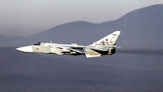 Фронтовой бомбардировщик Су-24. Архивное фото Фронтовой бомбардировщик Су-24. Архивное фото