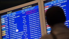 Табло с информацией о вылетах. Архивное фото Табло с информацией о вылетах. Архивное фото