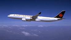 Самолет авиакомпании Air Canada. Архивное фото Самолет авиакомпании Air Canada. Архивное фото