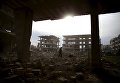 Разрушенные здания в пригороде Дамаска, Сирия Разрушенные здания в пригороде Дамаска, Сирия