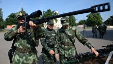 Служащие полиции Китая во время совместных тактико-специальных занятий спецназовцев Национальной гвардии России и Народной вооруженной полиции Китая Сотрудничество-2016 Служащие полиции Китая во время совместных тактико-специальных занятий спецназовцев Национальной гвардии России и Народной вооруженной полиции Китая Сотрудничество-2016