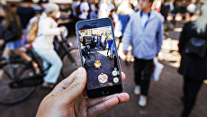 Игра Pokemon Go на экране мобильного телефона. Архивное фото Игра Pokemon Go на экране мобильного телефона. Архивное фото