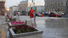 Горожане на Тверской улице. Архивное фото Горожане на Тверской улице. Архивное фото