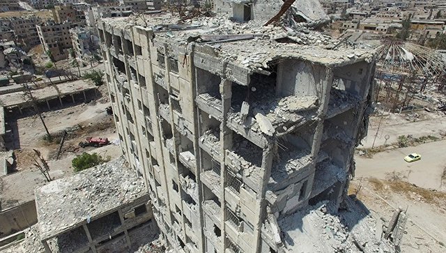Разрушенное здание в квартале Бани-Зейд на севере Алеппо. Архивное фото