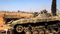 Бронетехника сирийской армии, поврежденная при штурме школы ВВС на юге Алеппо. Архивное фото Бронетехника сирийской армии, поврежденная при штурме школы ВВС на юге Алеппо. Архивное фото