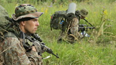 Военнослужащие Центра специального назначения войск национальной гвардии РФ во время учений. Архивное фото Военнослужащие Центра специального назначения войск национальной гвардии РФ во время учений. Архивное фото
