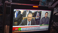 Ньюсрум телеканала Russia Today во время прямого эфира на английском языке. Архивное фото Ньюсрум телеканала Russia Today во время прямого эфира на английском языке. Архивное фото