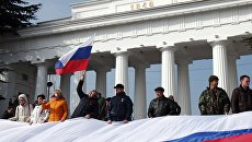 Участники праздничных мероприятий, посвященных годовщине присоединения Крыма к России. Архивное фото Участники праздничных мероприятий, посвященных годовщине присоединения Крыма к России. Архивное фото