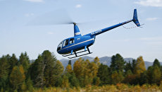 Вертолет Robinson R44. Архивное фото Вертолет Robinson R44. Архивное фото