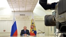 Russian President Vladimir Putin during a communication with the expedition leader in Antarctica Club in the teleconference.  November 3, 2016