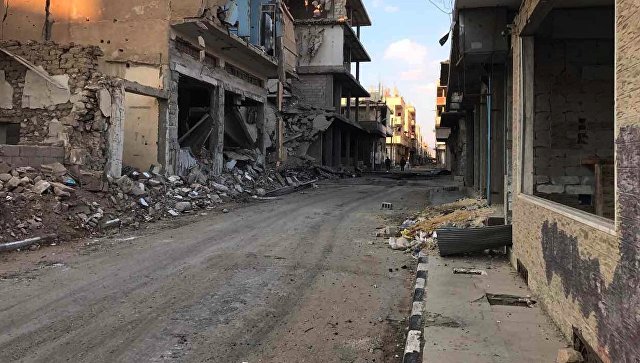 Разрушенные в результате боевых действий дома в жилой части города Пальмира. Архивное фото