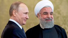 Президент РФ Владимир Путин и президент Исламской Республики Иран Хасан Роухани. Архивное фото Президент РФ Владимир Путин и президент Исламской Республики Иран Хасан Роухани. Архивное фото