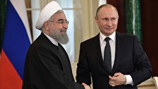 Президент РФ Владимир Путин и президент Исламской Республики Иран Хасан Роухани. Архивное фото Президент РФ Владимир Путин и президент Исламской Республики Иран Хасан Роухани. Архивное фото