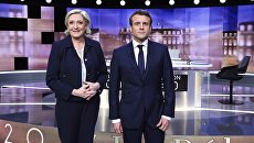 Кандидаты в президенты Франции — основатель движения Вперед Эммануэль Макрон и лидер партии Национальный фронт Марин Ле Пен на теледебатах Кандидаты в президенты Франции — основатель движения Вперед Эммануэль Макрон и лидер партии Национальный фронт Марин Ле Пен на теледебатах