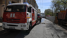 Пожарные расчеты МЧС РФ в центре Москвы. Архивное фото Пожарные расчеты МЧС РФ в центре Москвы. Архивное фото