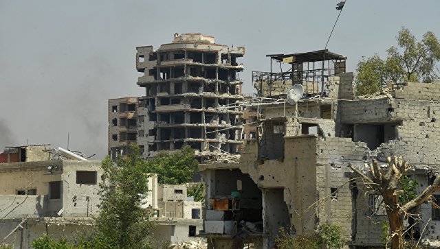 Разрушенные здания в квартале Кабун в пригороде Дамаска. Архивное фото