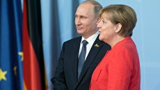 Президент РФ Владимир Путин и канцлер Германии Ангела Меркель. Архивное фото Президент РФ Владимир Путин и канцлер Германии Ангела Меркель. Архивное фото