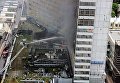 Сотрудники противопожарной службы на тушении возгорания в высотном здании на улице Новый Арбат в Москве Сотрудники противопожарной службы на тушении возгорания в высотном здании на улице Новый Арбат в Москве