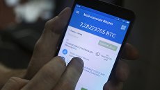 Мобильное приложение для работы с криптовалютой. Архивное фото Мобильное приложение для работы с криптовалютой. Архивное фото