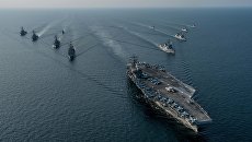 Авианосная ударная группа ВМС США во главе с атомным авианосцем Ronald Reagan во время совместных учений с кораблями Южной Кореи Invincible Spirit. Архивное фото Авианосная ударная группа ВМС США во главе с атомным авианосцем Ronald Reagan во время совместных учений с кораблями Южной Кореи Invincible Spirit. Архивное фото