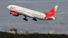Самолет Boeing 777-200 авиакомпании ВИМ-Авиа. Архивное фото Самолет Boeing 777-200 авиакомпании ВИМ-Авиа. Архивное фото