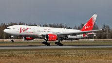 Самолет Boeing 777-200 авиакомпании ВИМ-Авиа в аэропорту Пулково в Санкт-Петербурге Самолет Boeing 777-200 авиакомпании ВИМ-Авиа в аэропорту Пулково в Санкт-Петербурге