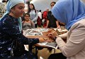 Посетитель на XVIII Московском Международном конкурсе чтецов Корана в Москве Посетитель на XVIII Московском Международном конкурсе чтецов Корана в Москве