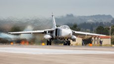 Бомбардировщик Су-24 ВКС России на авиабазе Хмеймим в Сирии. Архивное фото Бомбардировщик Су-24 ВКС России на авиабазе Хмеймим в Сирии. Архивное фото