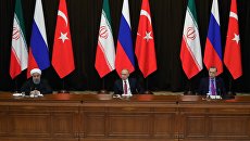 Владимир Путин, президент Ирана Хасан Рухани и президент Турции Реджеп Тайип Эрдоган во время совместного заявления для прессы по итогам встречи. 22 ноября 2017 Владимир Путин, президент Ирана Хасан Рухани и президент Турции Реджеп Тайип Эрдоган во время совместного заявления для прессы по итогам встречи. 22 ноября 2017