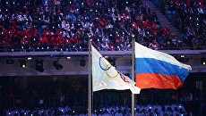 Олимпийский флаг и флаг России на Играх в Сочи Олимпийский флаг и флаг России на Играх в Сочи