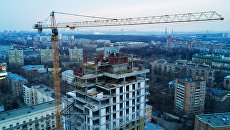 Строительство многоквартирного жилого дома в Москве. Архивное фото Строительство многоквартирного жилого дома в Москве. Архивное фото