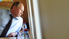 Президент РФ Владимир Путин в салоне вертолета. Архивное фото Президент РФ Владимир Путин в салоне вертолета. Архивное фото