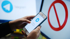 Мессенджер Telegram на экране телефона. Архивное фото Мессенджер Telegram на экране телефона. Архивное фото