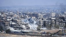 Разрушенные дома в районе лагеря беженцев Ярмук на юге Дамаска Разрушенные дома в районе лагеря беженцев Ярмук на юге Дамаска