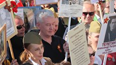 Мэр Москвы Сергей Собянин на акции Бессмертный полк в Москве. 9 мая 2018 Мэр Москвы Сергей Собянин на акции Бессмертный полк в Москве. 9 мая 2018