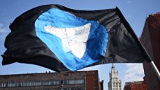 Флаг с логотипом мессенджера Telegram. Архивное фото Флаг с логотипом мессенджера Telegram. Архивное фото