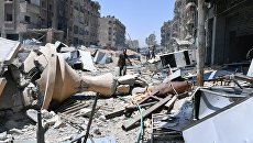 Разрушенные дома в освобожденном лагере палестинских беженцев Ярмук на юге Дамаска. Архивное фото Разрушенные дома в освобожденном лагере палестинских беженцев Ярмук на юге Дамаска. Архивное фото