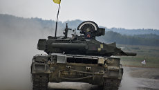 Украинские военные из 14-й волынской механизированной бригады ВСУ на танке Т-84 во время соревнований Strong Europe Tank Challenge в городе Графенвер, Германия. 6 июня 2018 Украинские военные из 14-й волынской механизированной бригады ВСУ на танке Т-84 во время соревнований Strong Europe Tank Challenge в городе Графенвер, Германия. 6 июня 2018