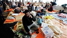 Люди, эвакуированные после землетрясения в Японии Люди, эвакуированные после землетрясения в Японии