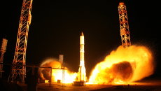 Запуск ракеты-носителя Протон-М со спутником связи. Архивное фото Запуск ракеты-носителя Протон-М со спутником связи. Архивное фото