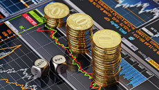 Стопки десятирублевых монет на экране с биржевыми графиками. Архивное фото Стопки десятирублевых монет на экране с биржевыми графиками. Архивное фото